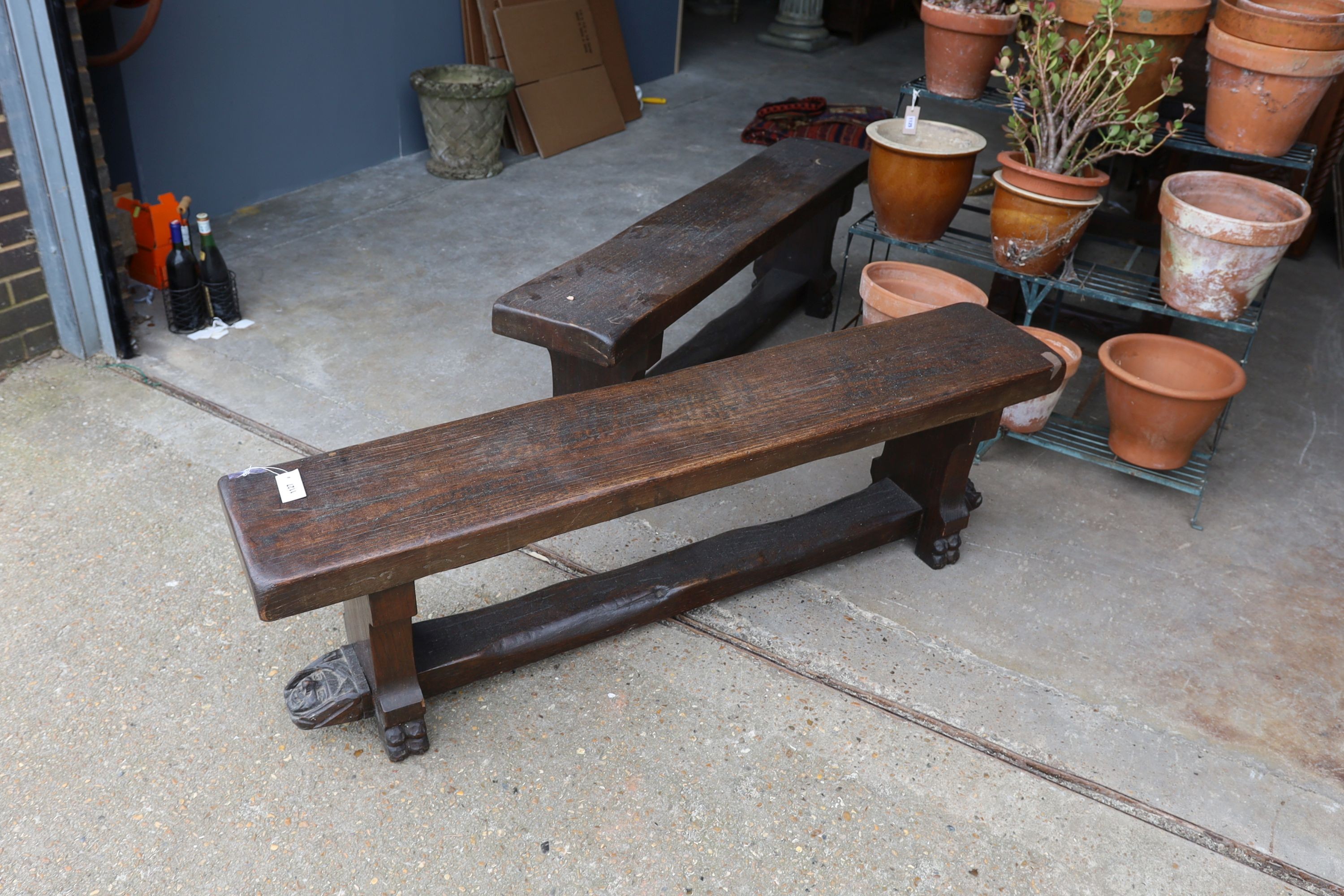 A pair of 17th century style carved oak New England benches, length 150cm, depth 28cm, height 46cm